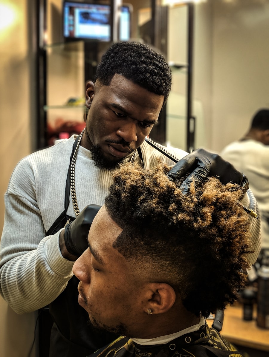 Curly top with a skin fade and blonde tips