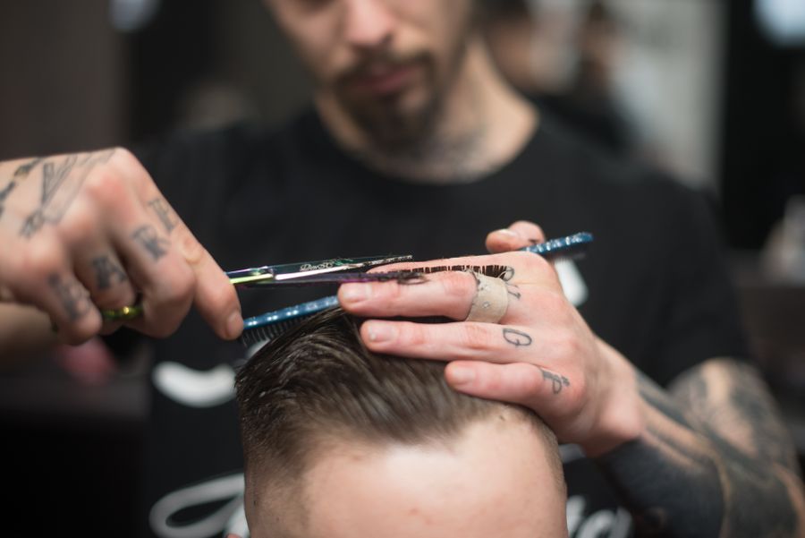Close-up of a men's scissor haircut at Moe's Barbershop