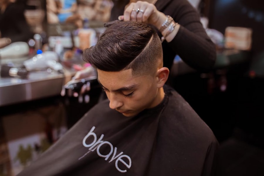 Men's side-part haircut with a skin fade at Moe's Barbershop
