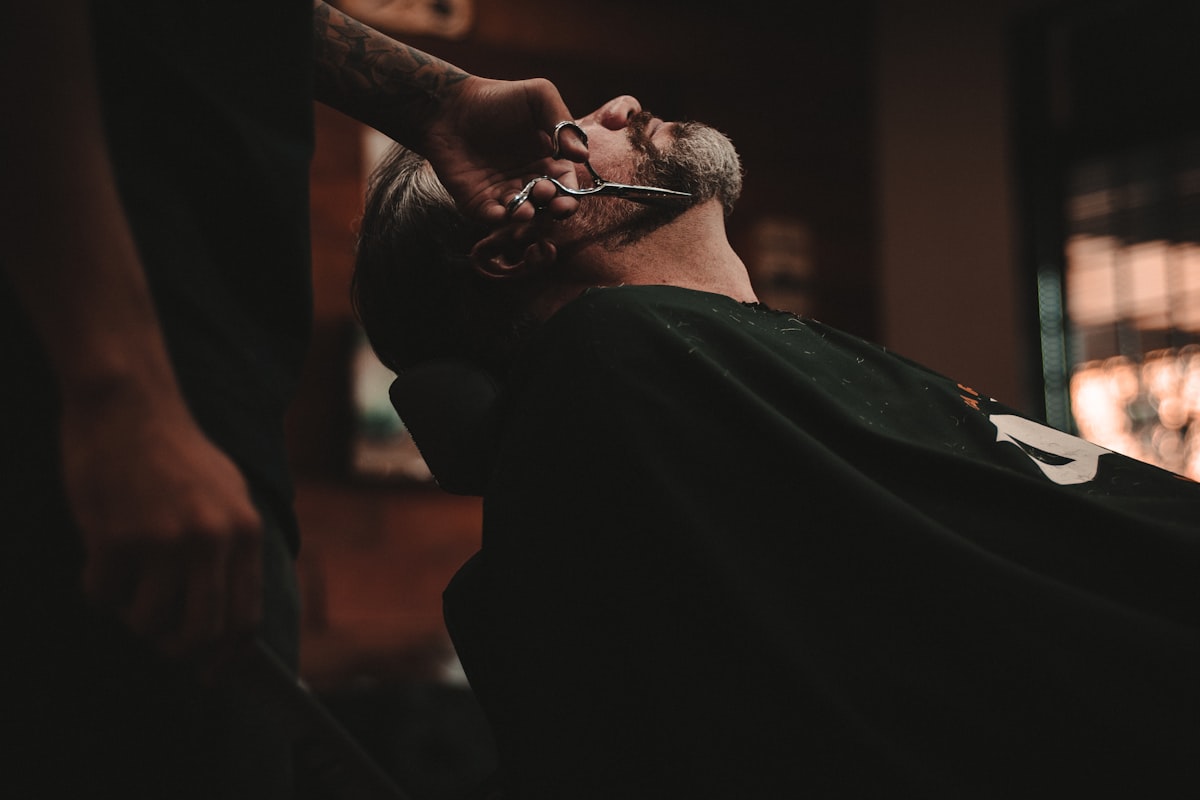 Scissor haircut in progress at Moe's Barbershop